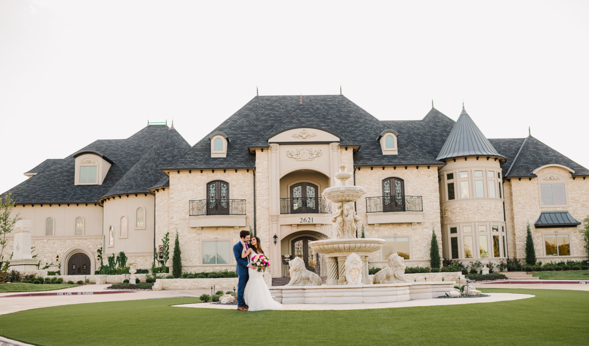 Wedding couple standing in front of an elegant venue