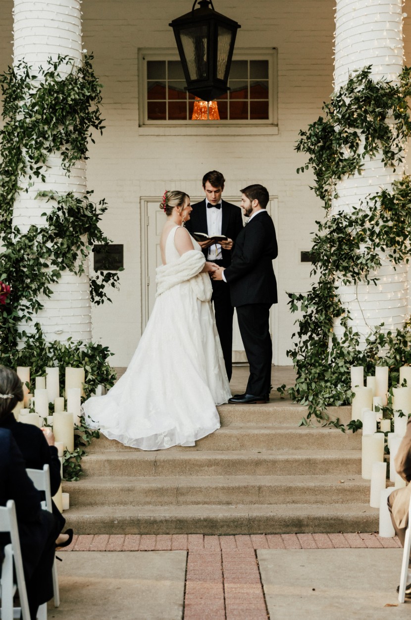 Newlyweds sharing a kiss on chapel steps