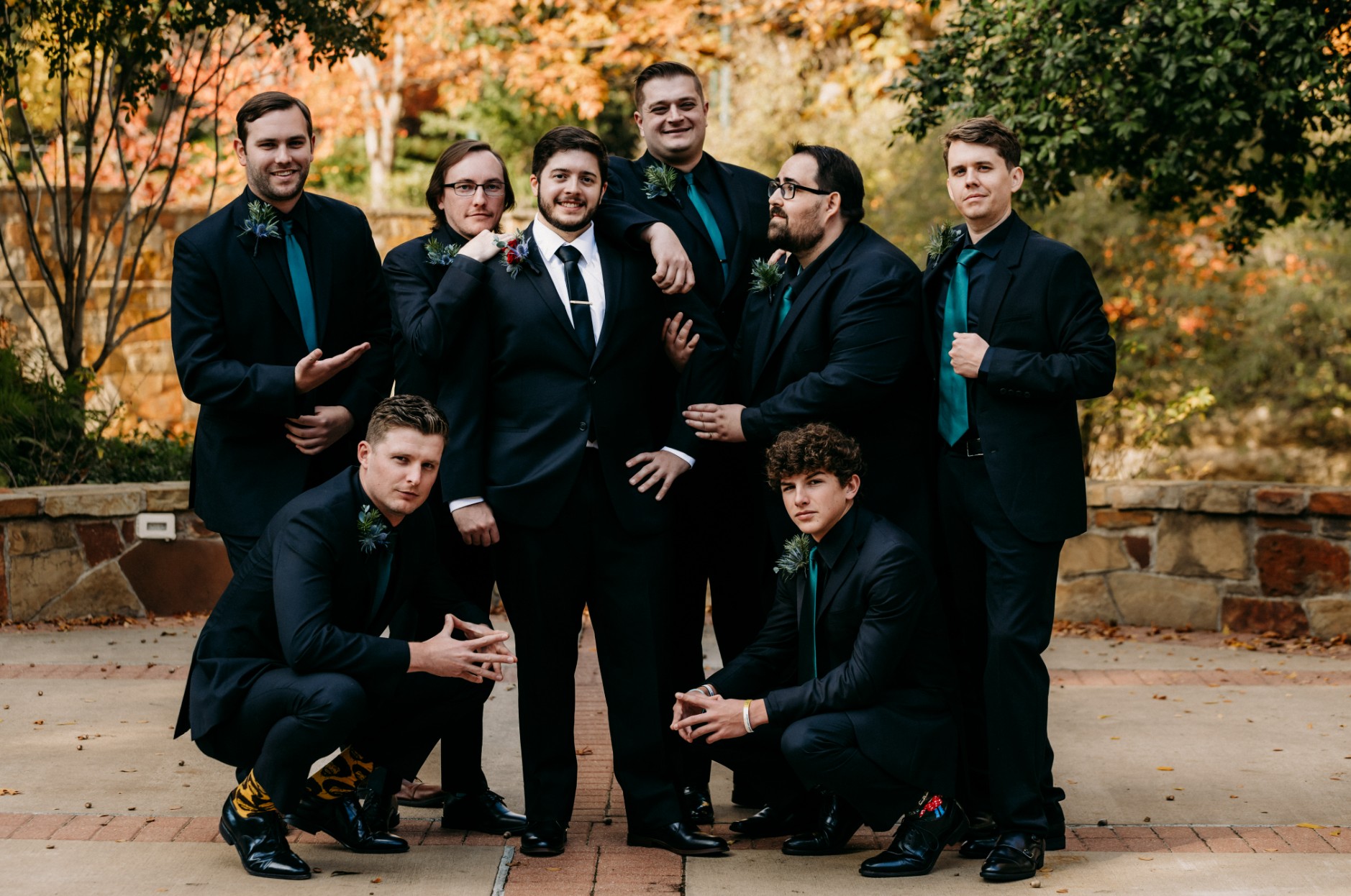 Groom with groomsmen in black suits