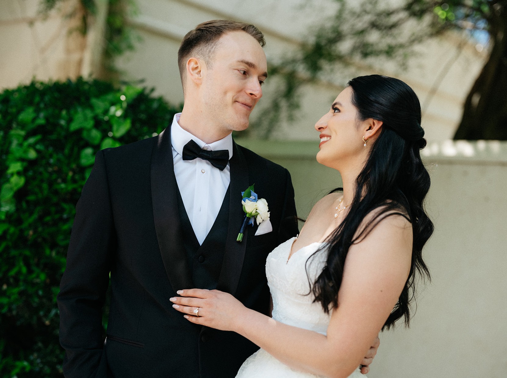 Newlyweds smiling together outdoors