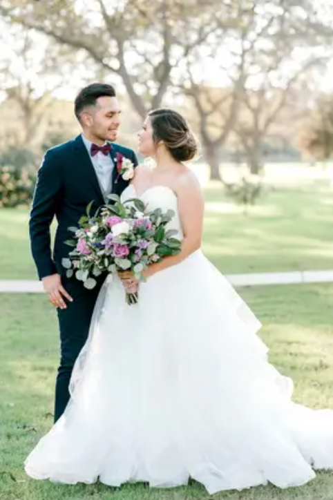 Wedding couple standing together after their ceremony