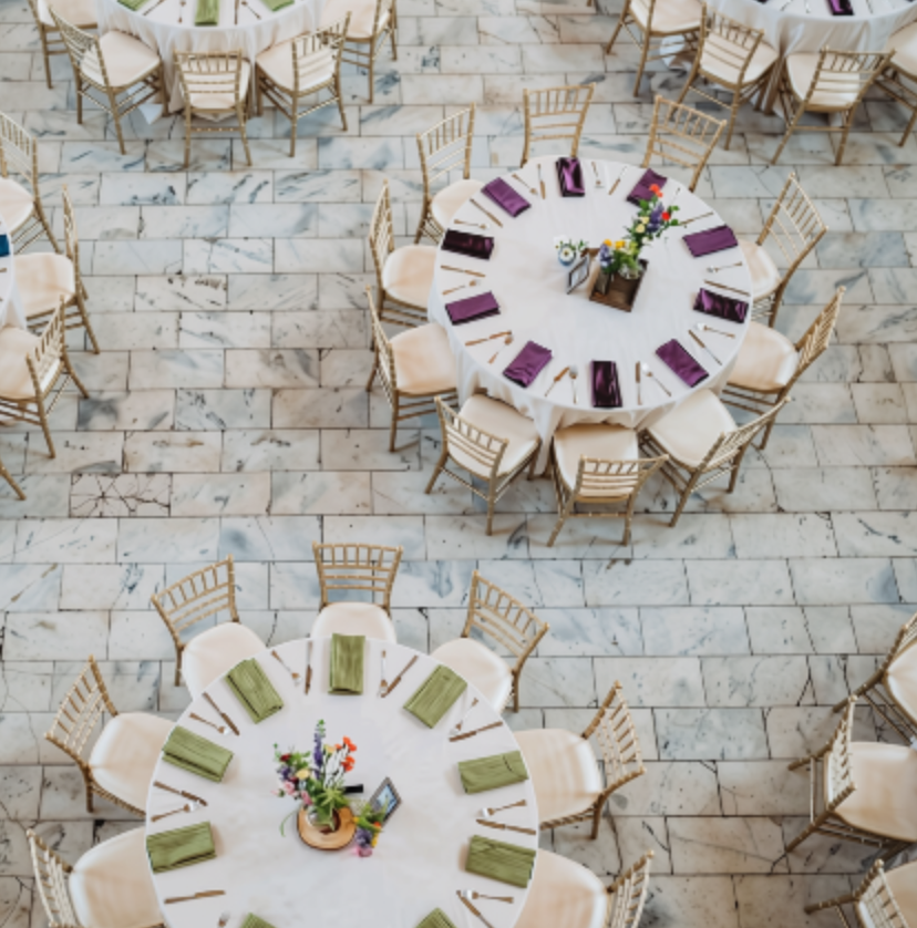 Reception tables with green and purple napkins