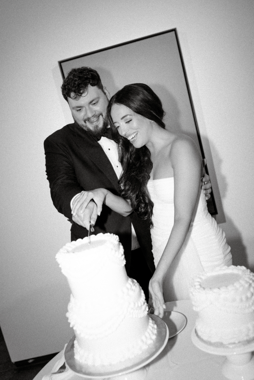 Wedding couple cutting their cake