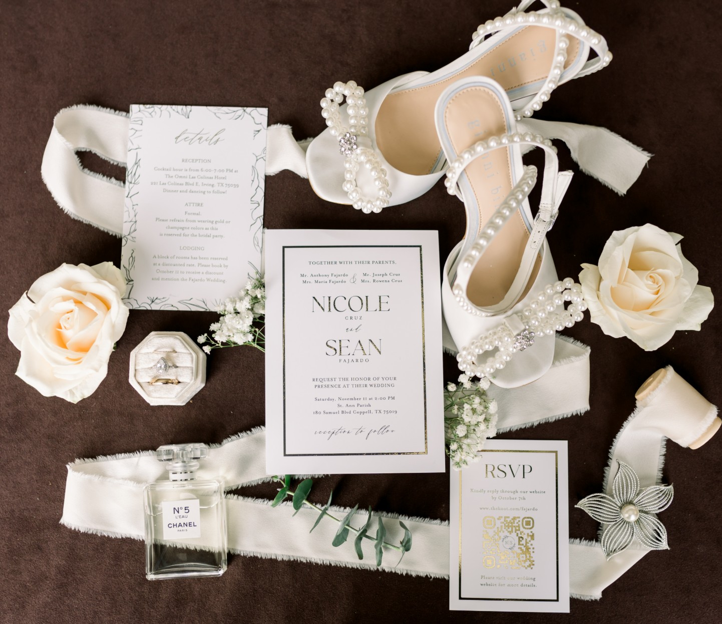 Wedding invitation flat lay with floral details