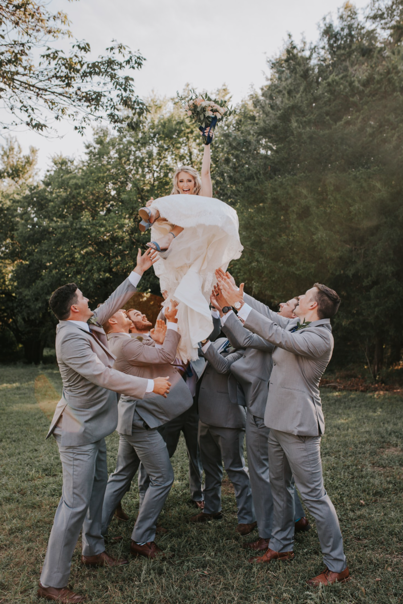 Wedding party gathered around the couple